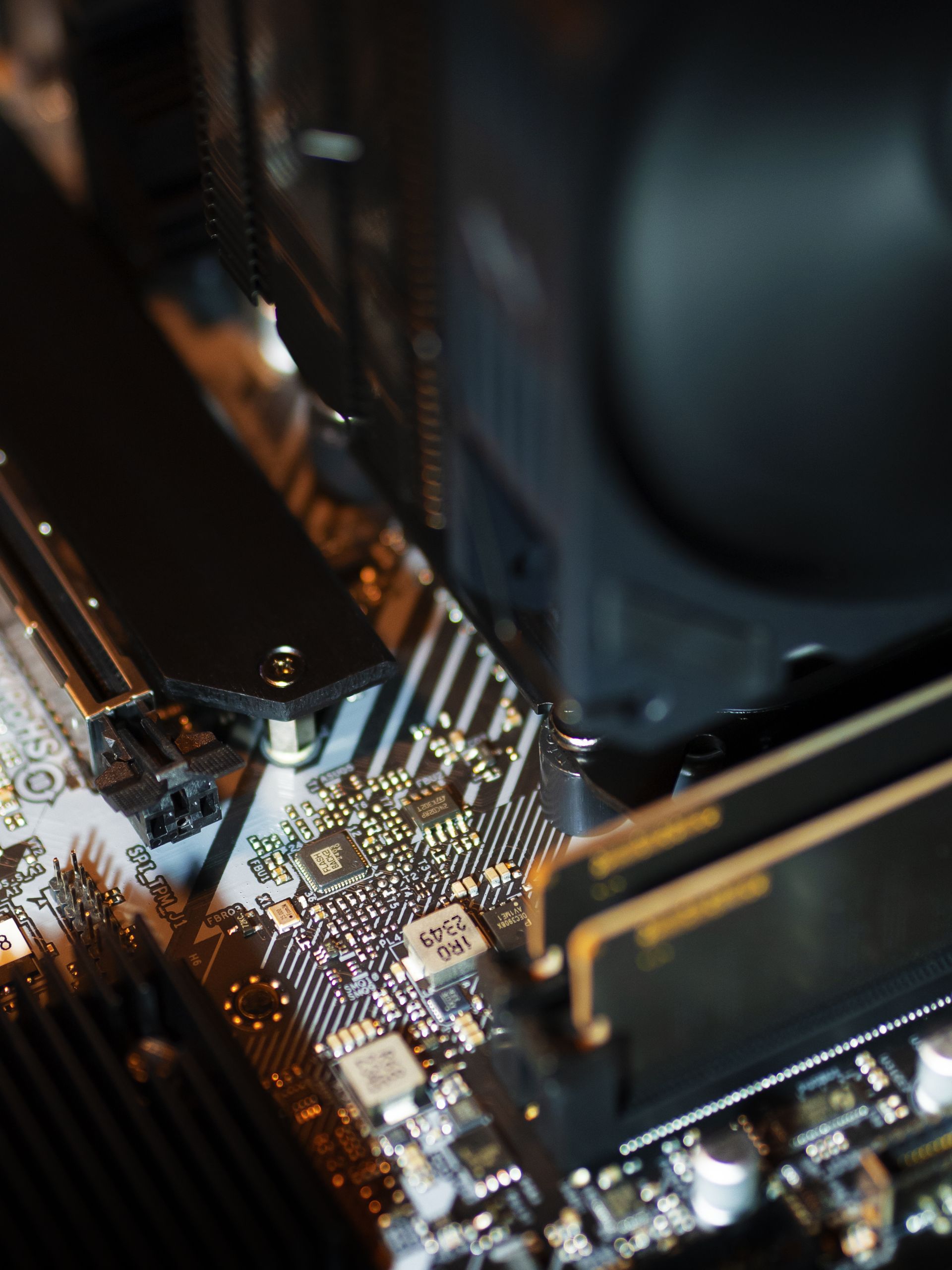 Home Detailed view of electronic components on a motherboard highlighting CPU and RAM areas.